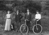 Two couples with bicycles and a dog
