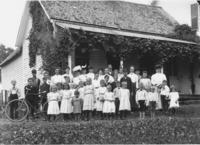 Group portrait at a family picnic in front of a house in Vermont