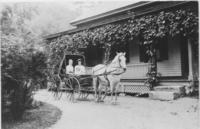 Mrs. Austin Powell in a carriage at the Brattleboro Retreat Farmhouse