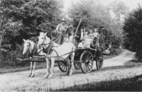 Claude Reed and his horse team, with a cart full of people, in Vermont