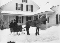 Delphia Yeaw and Wife on horse drawn sleigh in winter