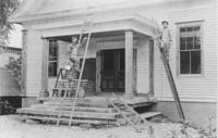 Two men on ladders paiting Williamsville Grange Hall, Vt.