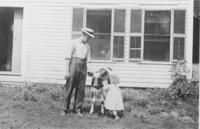 Marion Fairbanks and father with a calf, Williamsville, Vt.
