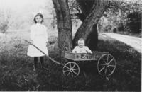 Florence Powers with a baby in a wagon, Williamsville, Vt.