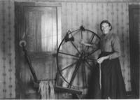 Mrs. Laure Bingham with her spinning wheel, South Newfane, Vt.