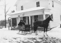 Man and Woman in a Sleigh in front of Western Union, Williamsville, Vt.