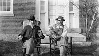 Lucius Stanton and an unidentified friend enjoy a glass of                        cider