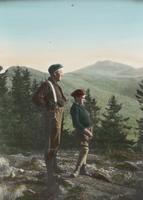 Man and boy on a rock clearing