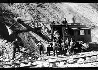 Railroad workers pictured with a steam powered shovel