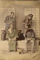 Two men getting their hair styled