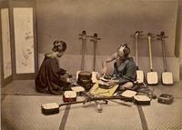 Shamisen crafter with a customer