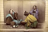 Two men attired as Samurai playing Shogi
