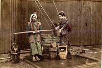 Two women getting water at a well