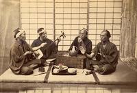 Group of men with Shamisen and sake