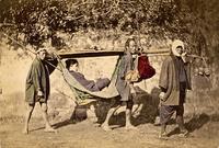 Three men carrying a woman in a palanquin